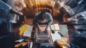 a captivating photo of a person sitting at a desk dUZ yJciRfaRFvHROX67rQ uf3Ok4XhQTmwEMGfMavupg